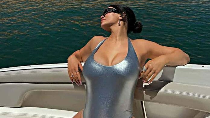 Kylie looking sizzling hot in a silver swimsuit