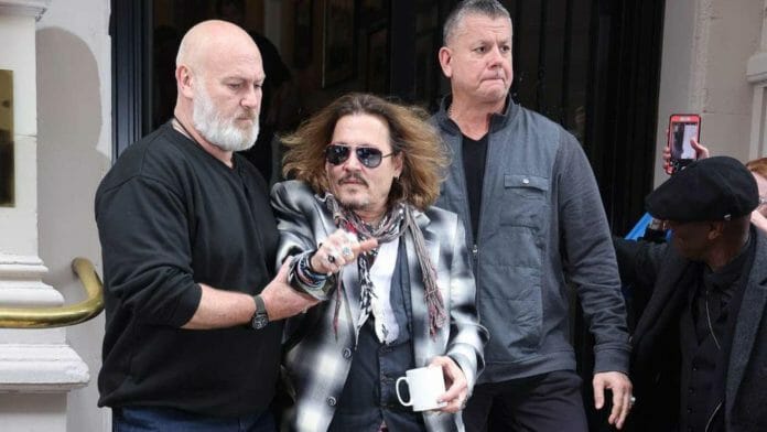 Johnny Depp was escorted by his bodyguard