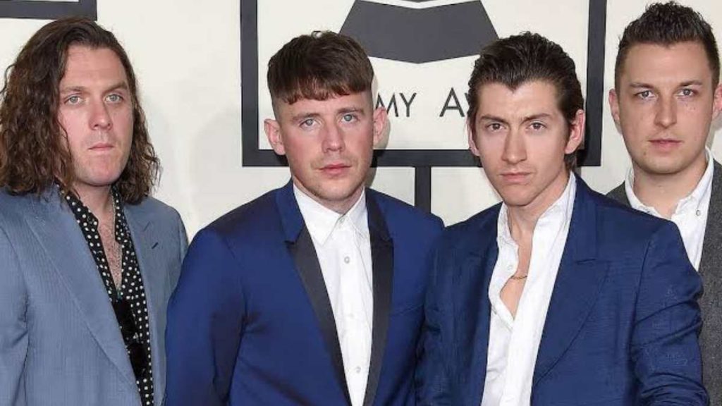 Alex Turner with his bandmates 