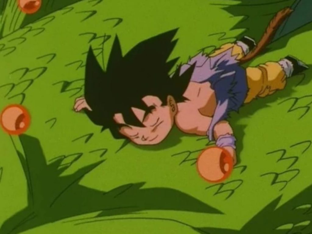 Goku riding on the back of Shenron