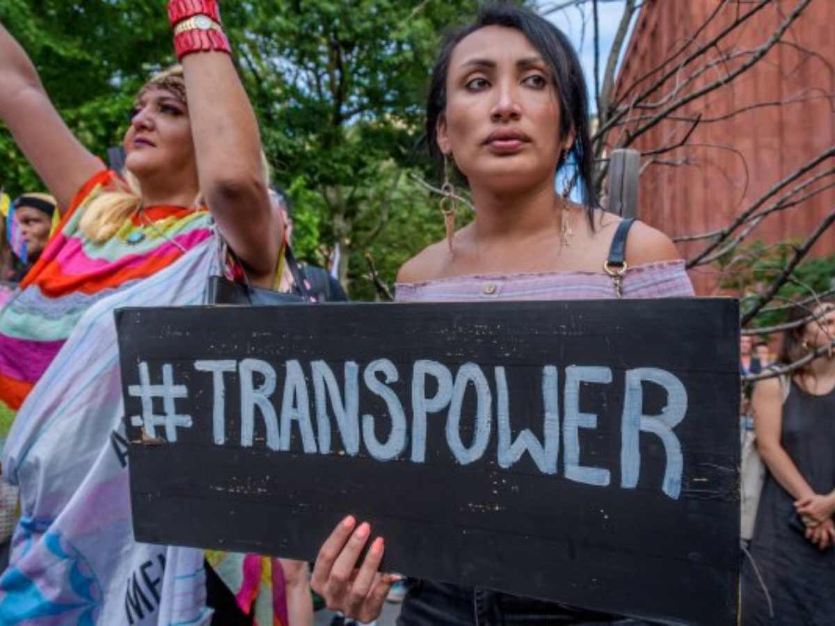 A transwoman protesting on street