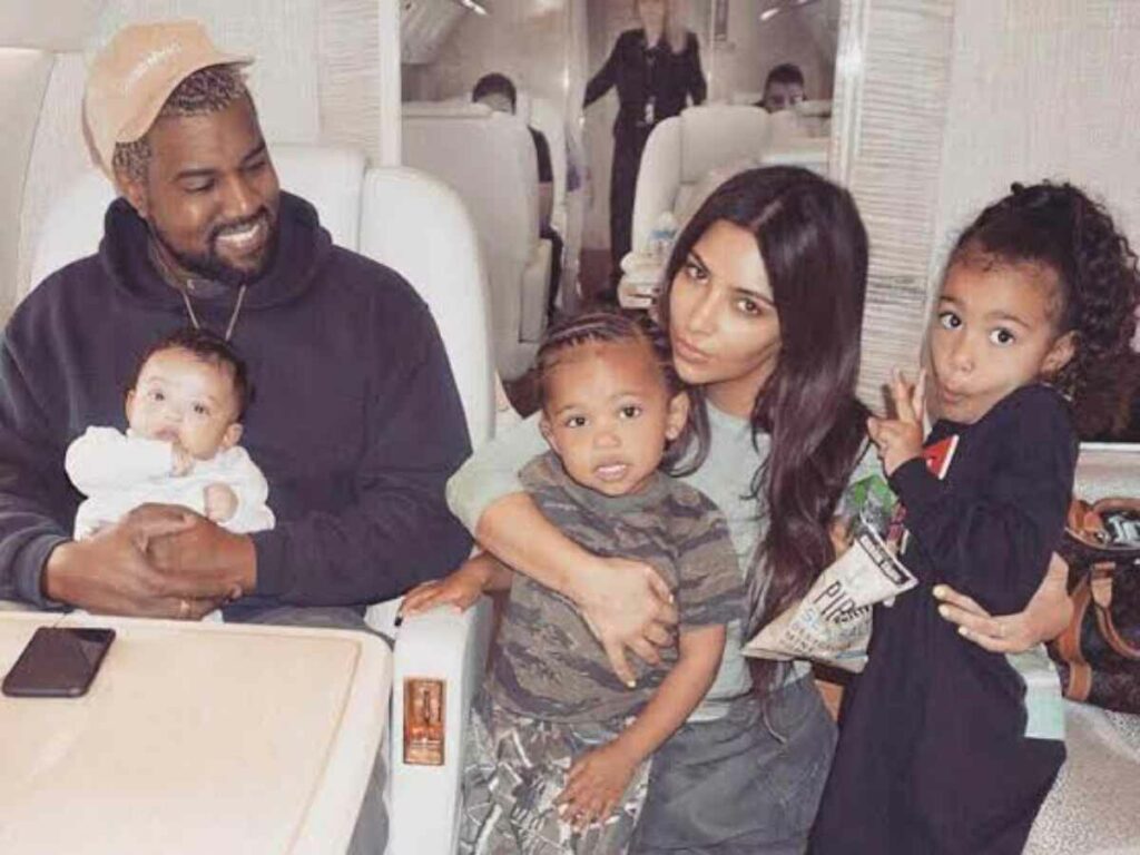 Kim Kardashian and Kanye West with their kids