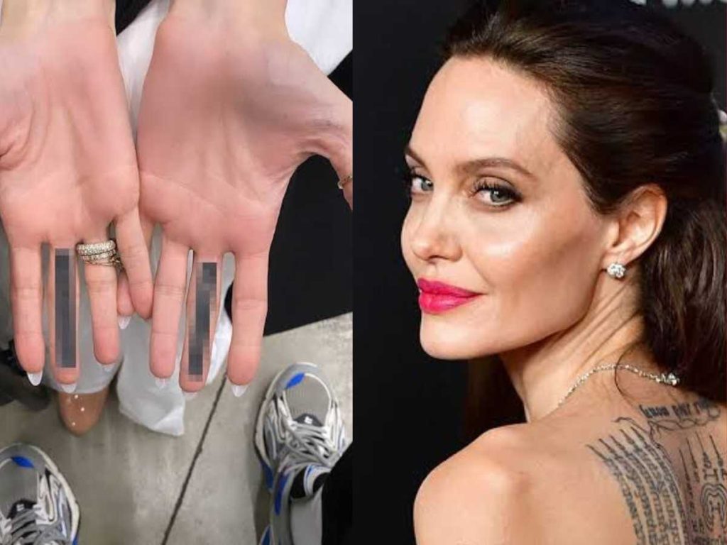 Angelina Jolie gets her middle fingers inked