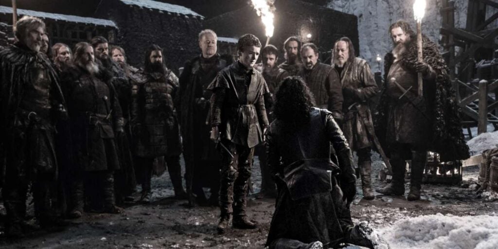 Brothers of Night's watch executing Jon Snow (Image: HBO) 