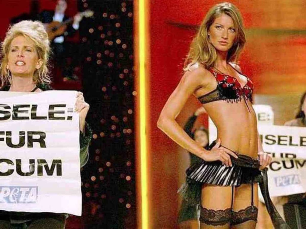 Gisele Bündchen walking amidst PeTA protestors 