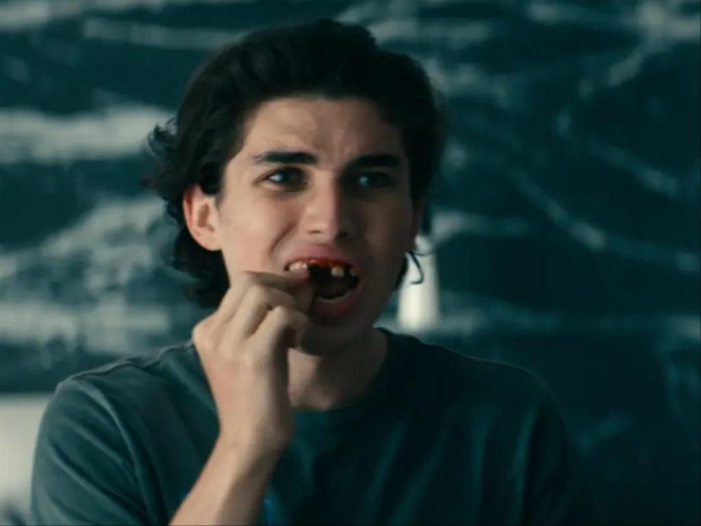 Archie’s teeth falls out in the film