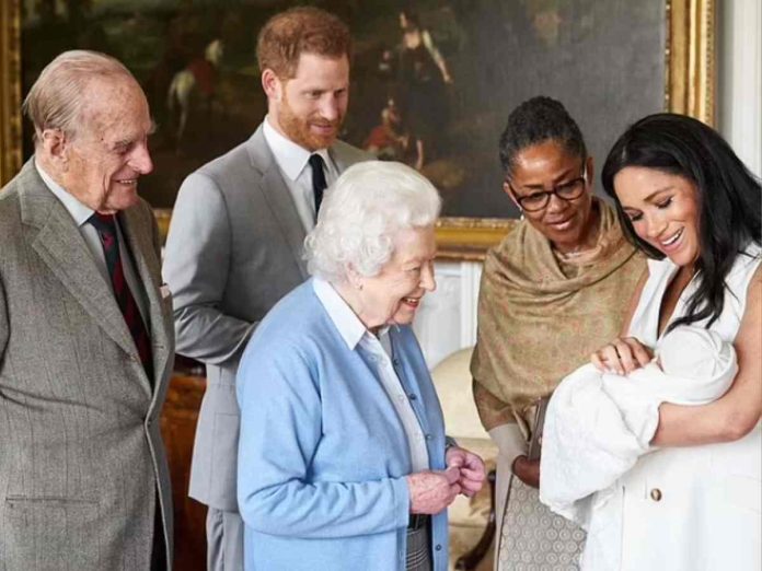 Queen Elizabeth with Meghan Markle, Prince Harry and Lilibet. (Image: Getty)