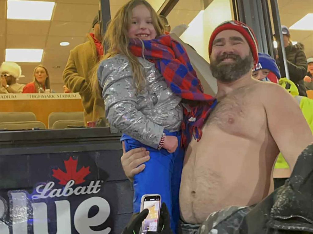 A shirtless Jason Kelce helping an 8-year-old fan meet Taylor Swift At The Chiefs-Bills Game