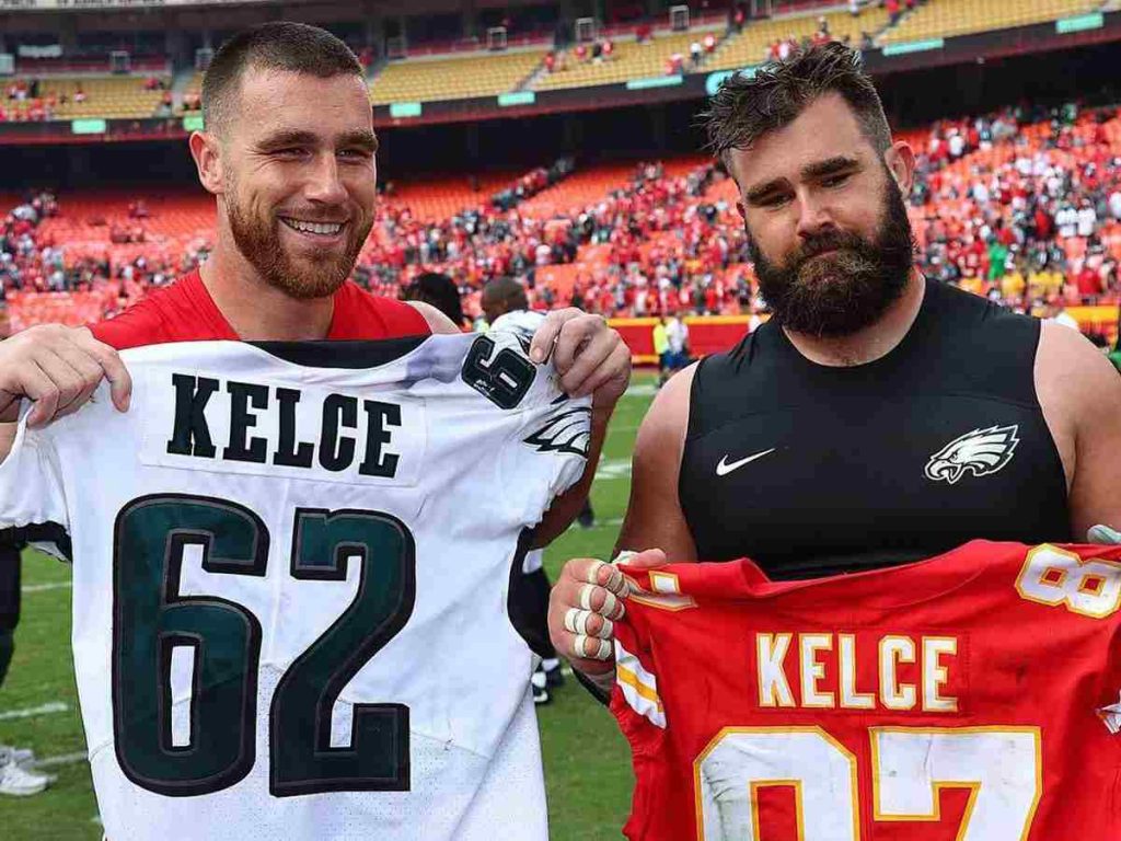 Jason and Travis Kelce holding each other's jersey