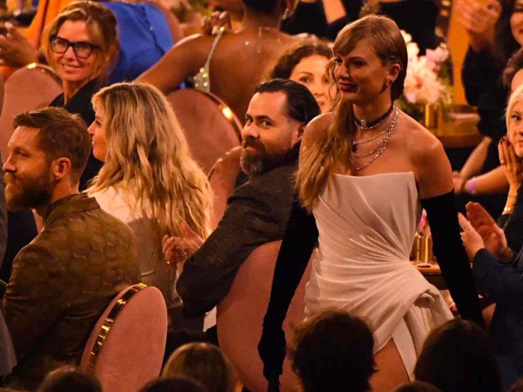 Taylor Swift walks past Calvin Harris at the Grammys