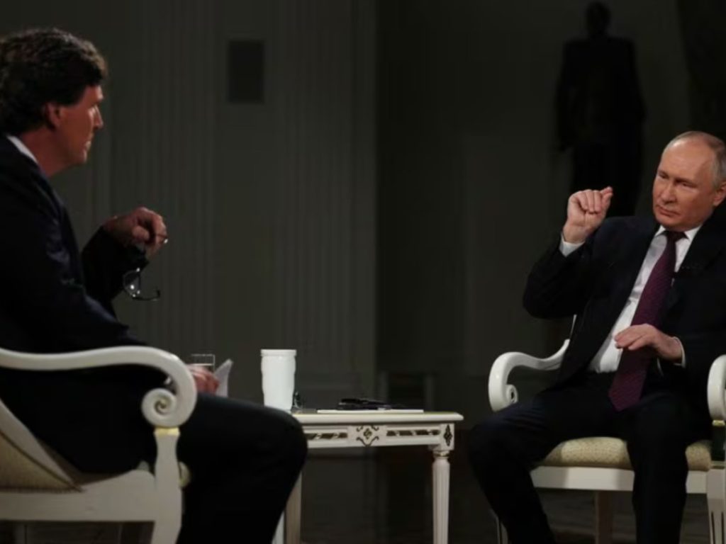 Vladimir Putin and Tucker Carlson (Image: Reuters)