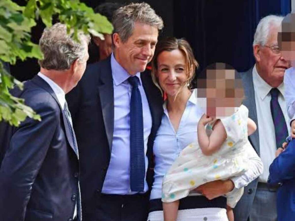 Hugh Grant and anna Eberstein with their child