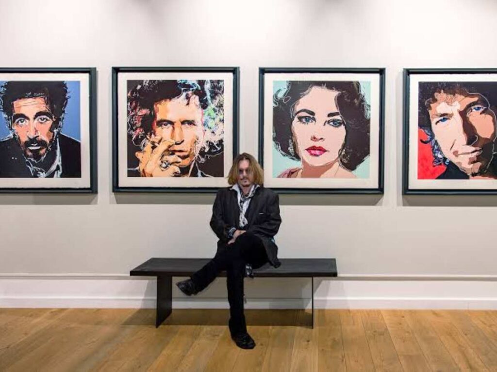 Johnny Depp with his artwork
