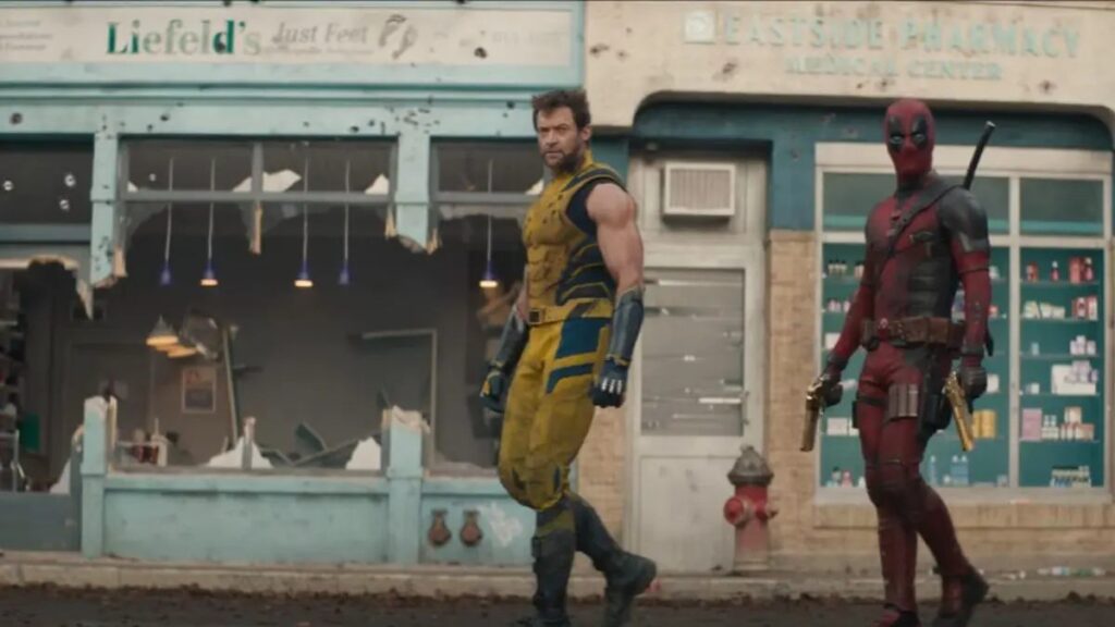 Deadpool and Wolverine infront off Liefeld's Just Feet store