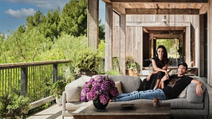 Ashton and Mila in their new house