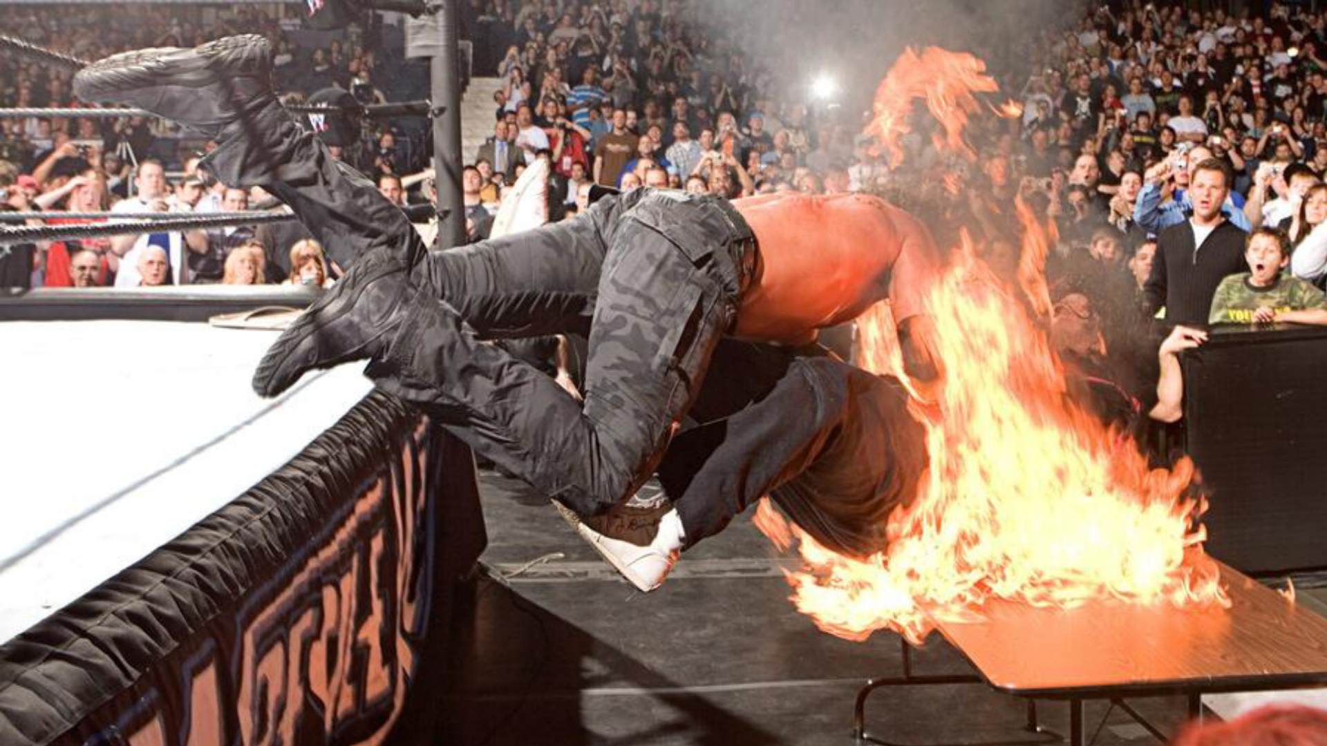 11. Edge spears Mick Foley through a burning table (WrestleMania 22)