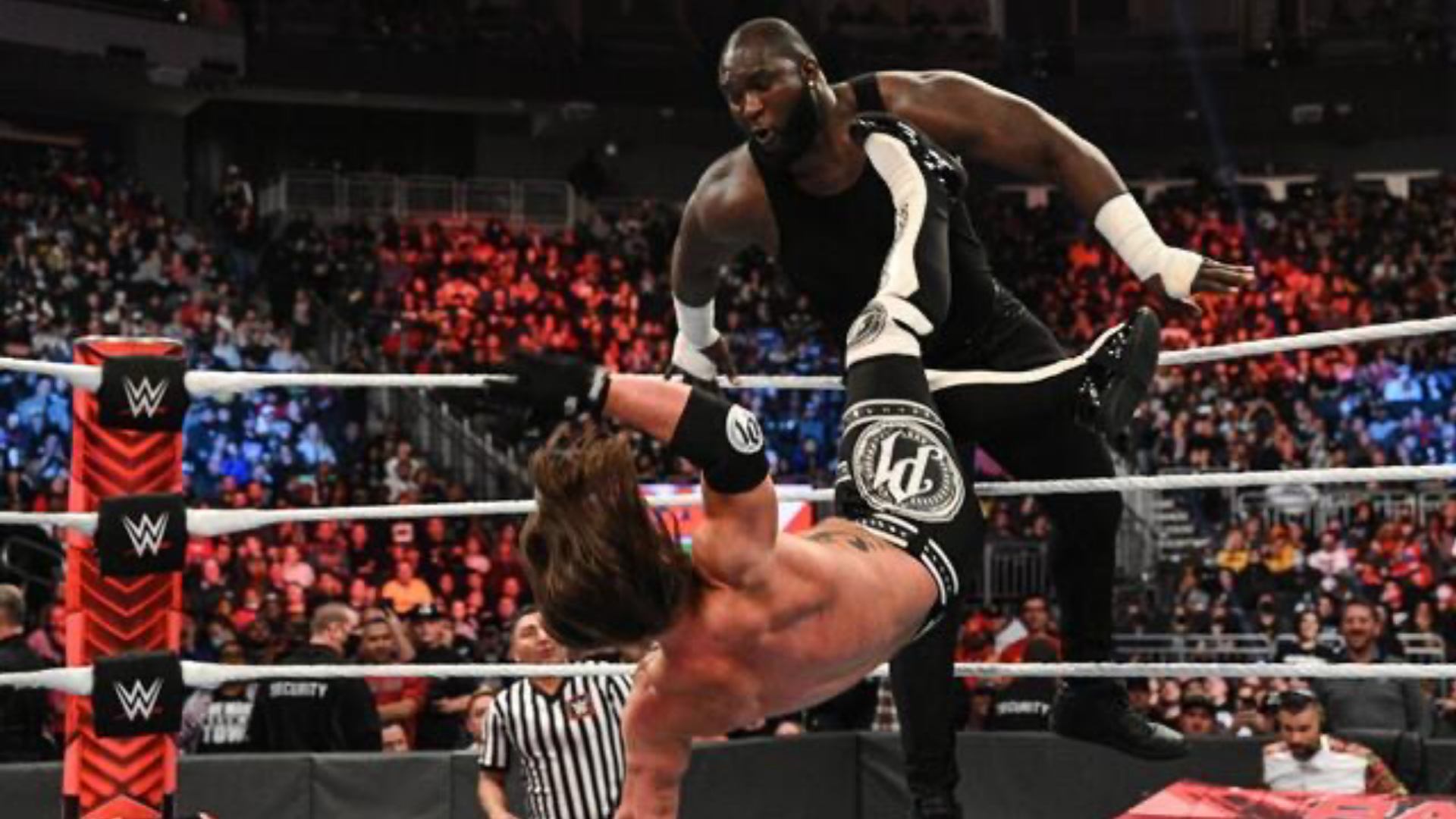 22. AJ Styles & Omos