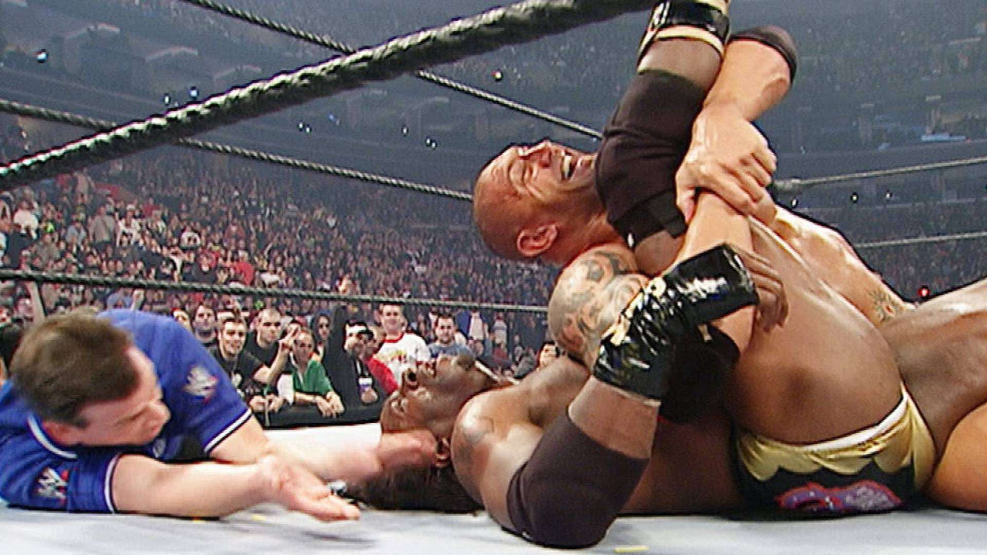 7) Batista and Booker T