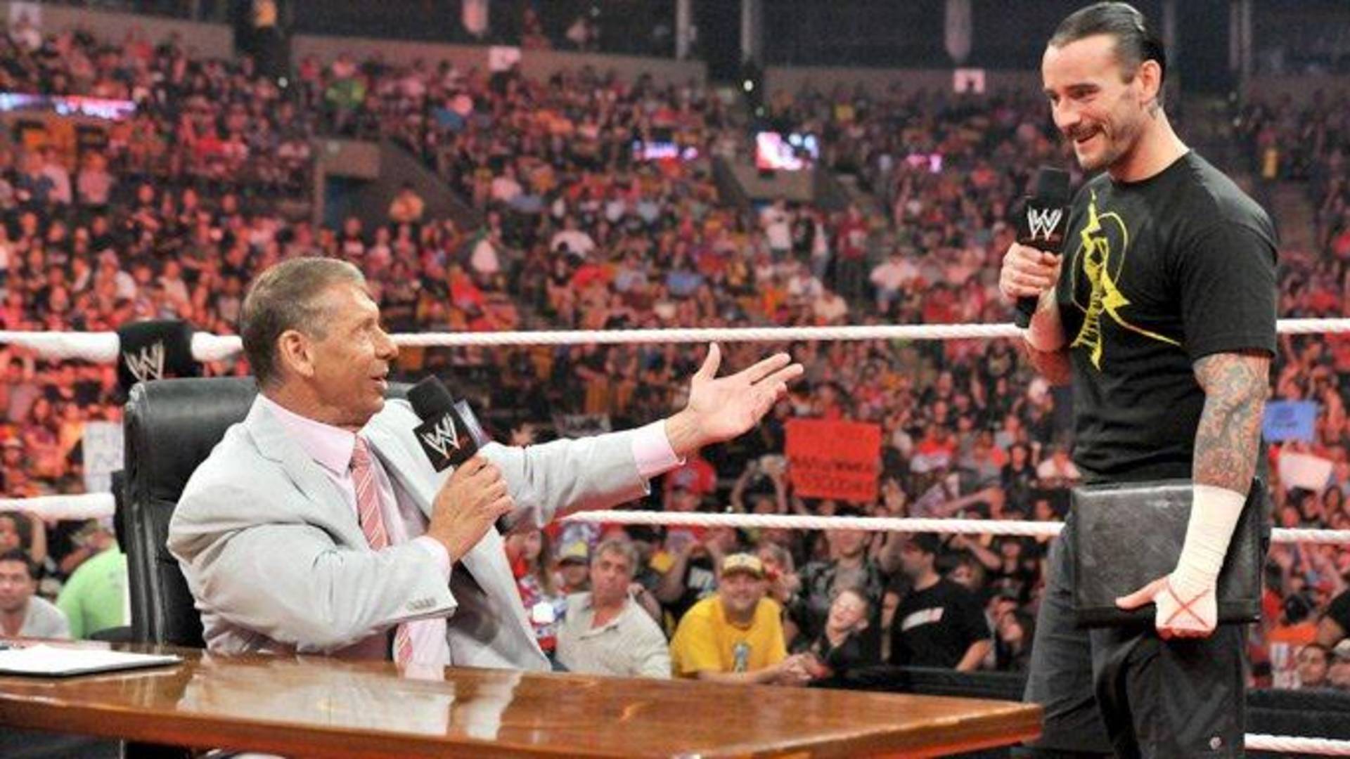 9- CM Punk, John Cena, and Vince McMahon Contract Signing