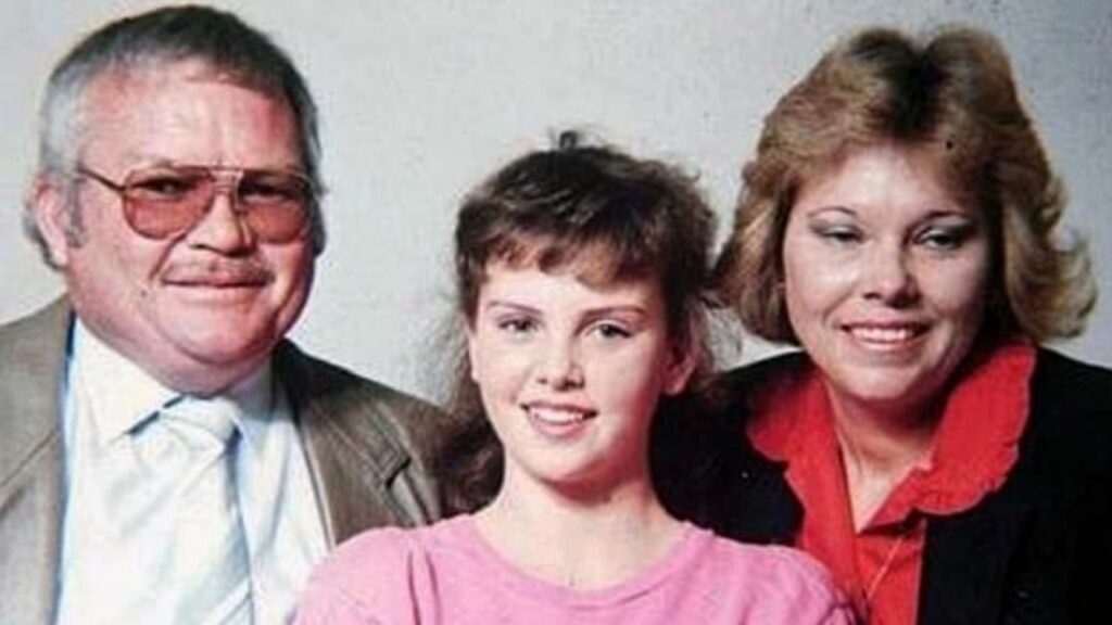 Charlize Theron with her mother and father