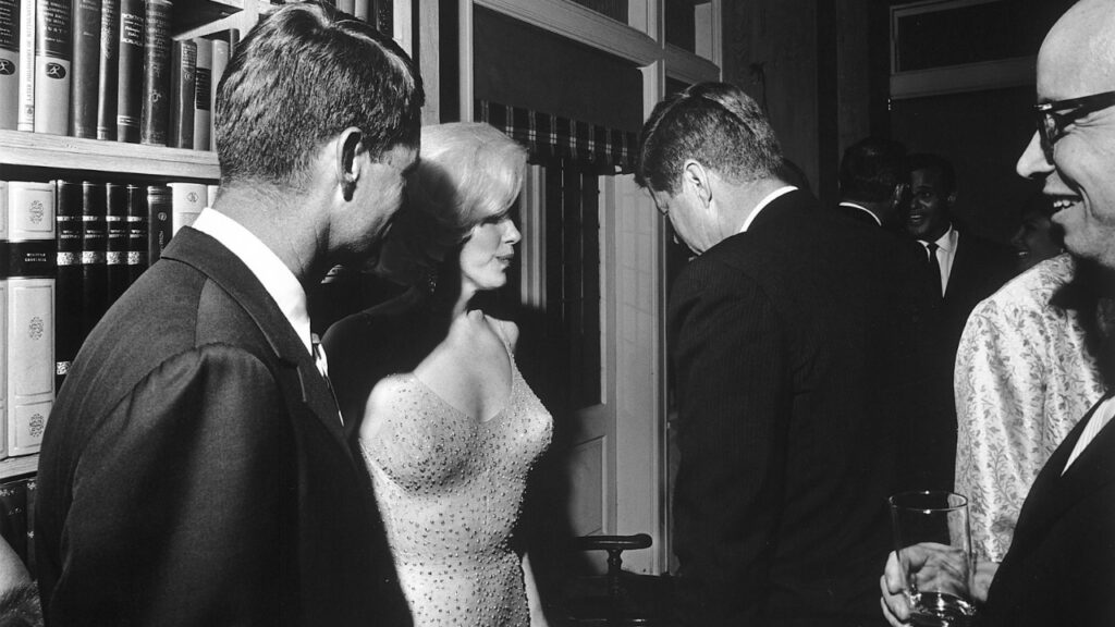 Marilyn Monroe standing between John F Kennedy and Robert F Kennedy (Image: Time Magazine)