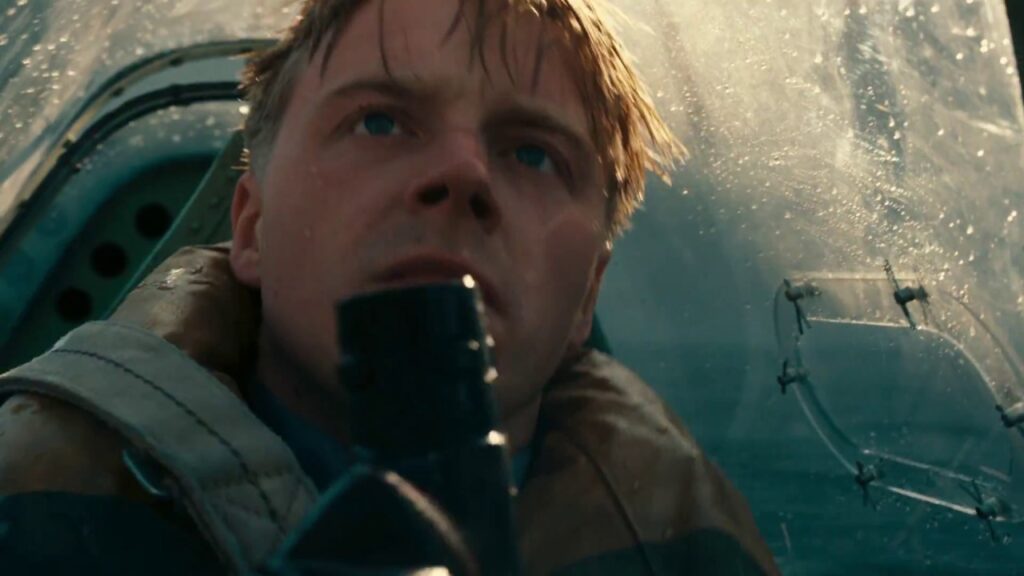 Collins crash-lands his Spitfire on the water after his engine is damaged in a dogfight (Image: Warner Bros.)