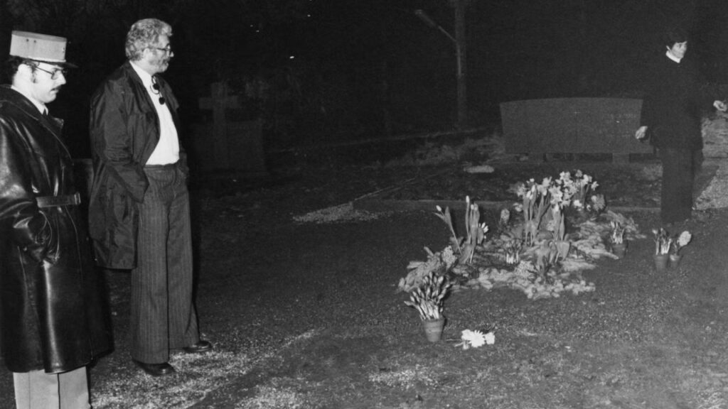 Police at the desecrated grave of Charlie Chaplin in the cemetery at Corsier-sur-Vevey, Switzerland (Image: The Independent)