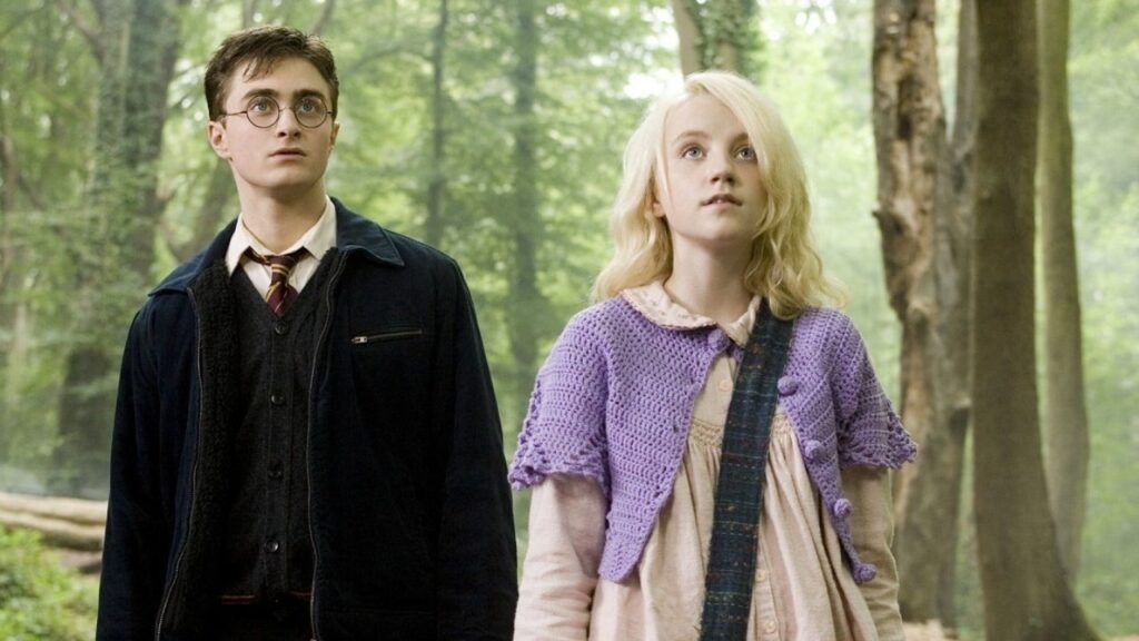 Daniel Radcliffe as Harry Potter and Evanna Lynch as Luna Lovegood (Image: Warner Bros.)