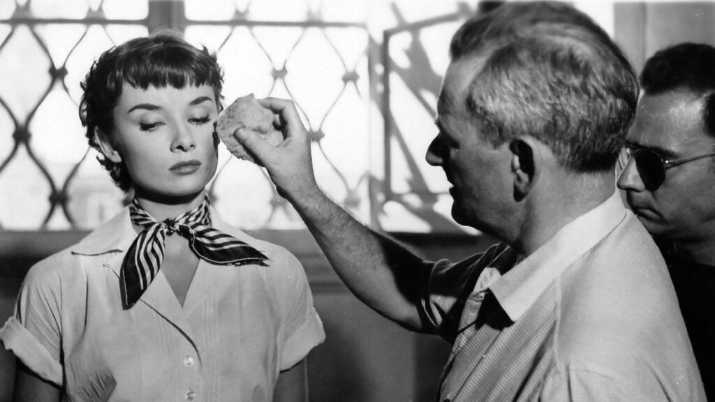 Audrey Hepburn and director William Wyler photographed on the set of Roman Holiday (Image: X)