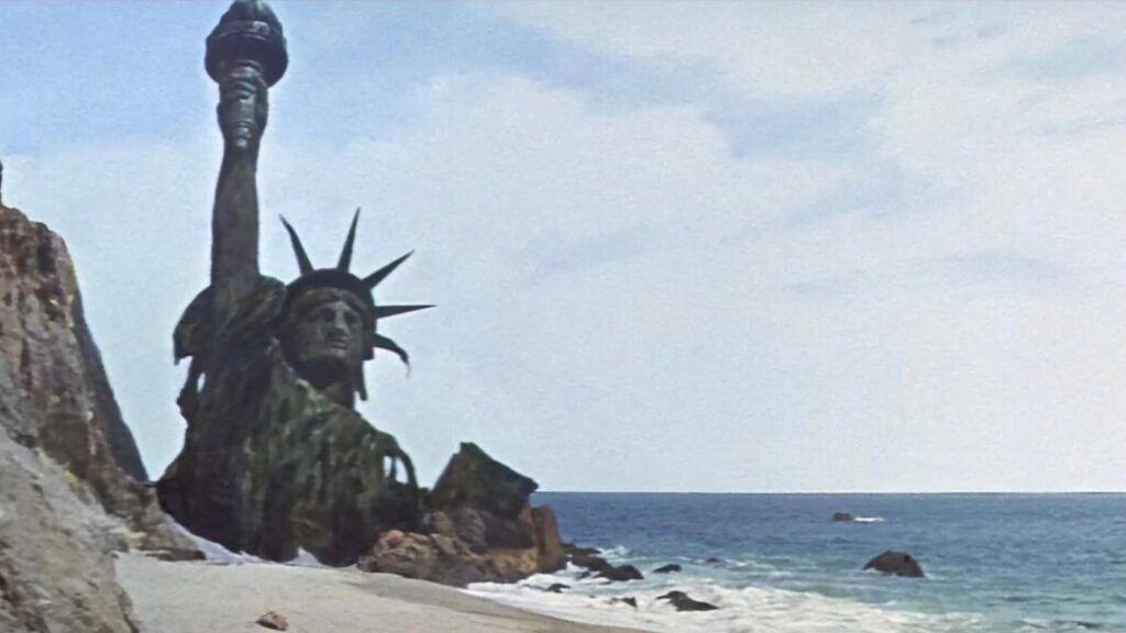 Half-buried Statue of Liberty in 'Planet of the Apes' (Image: 20th Century Studios)