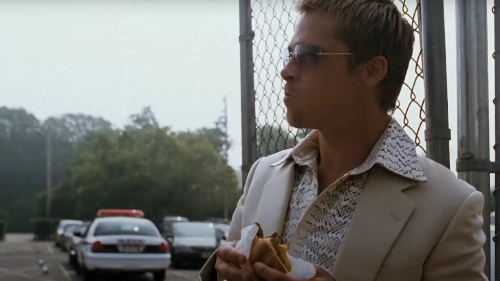 Brad Pitt eating in 'Ocean's Eleven' (Image: Warner Bros.)