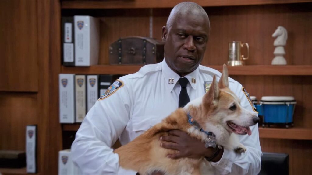 Captain Holt and Cheddar in Brooklyn Nine-Nine (Image: NBC)